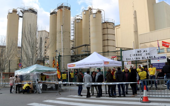 Factory workers protest against its closure in a Barcelona suburb